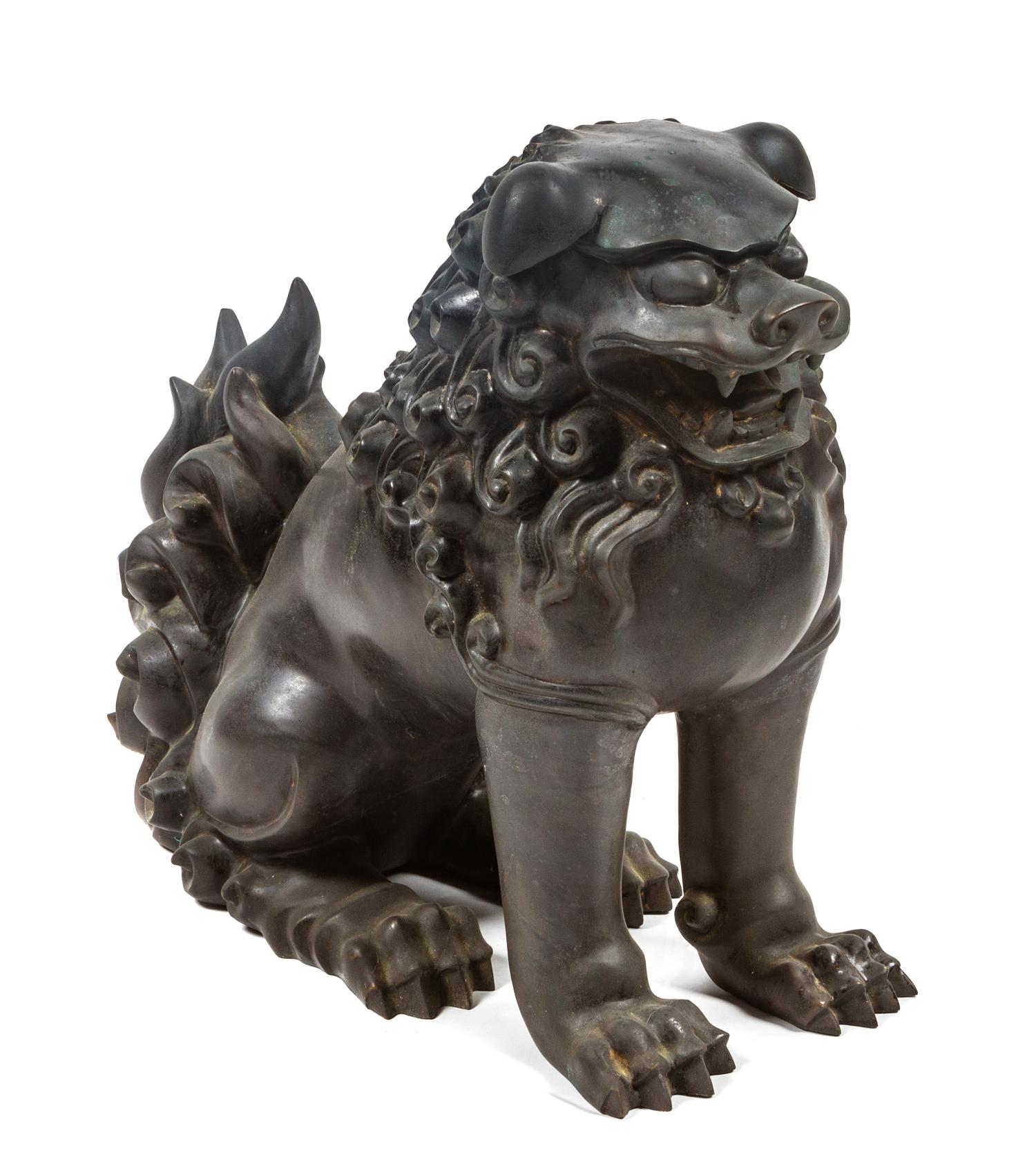A Bronze Chinese Foo Dog Height 15 1/4 inches.