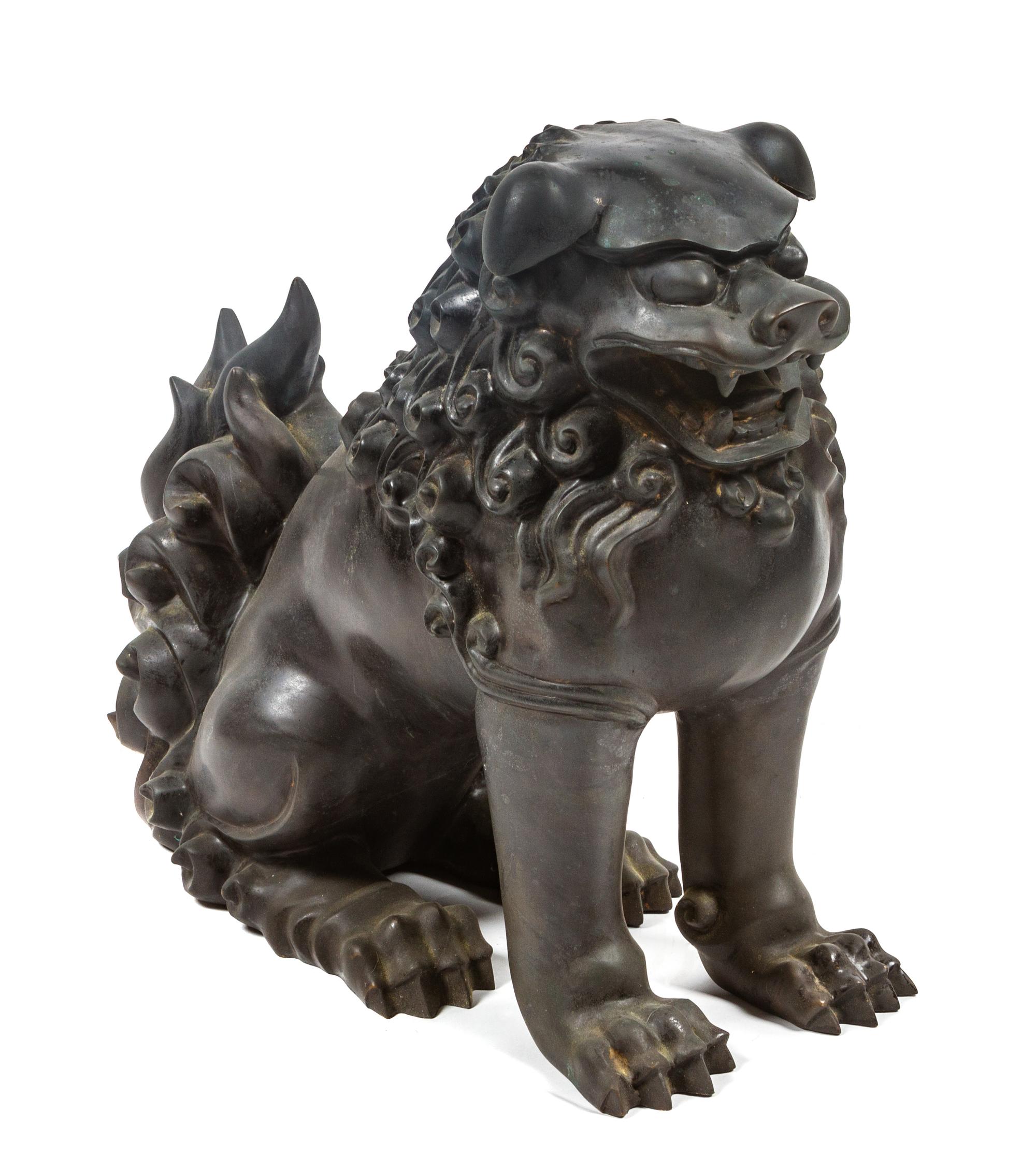 A Bronze Chinese Foo Dog Height 15 1/4 inches.