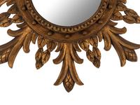 A Regency Style Carved Giltwood Sunburst Mirror