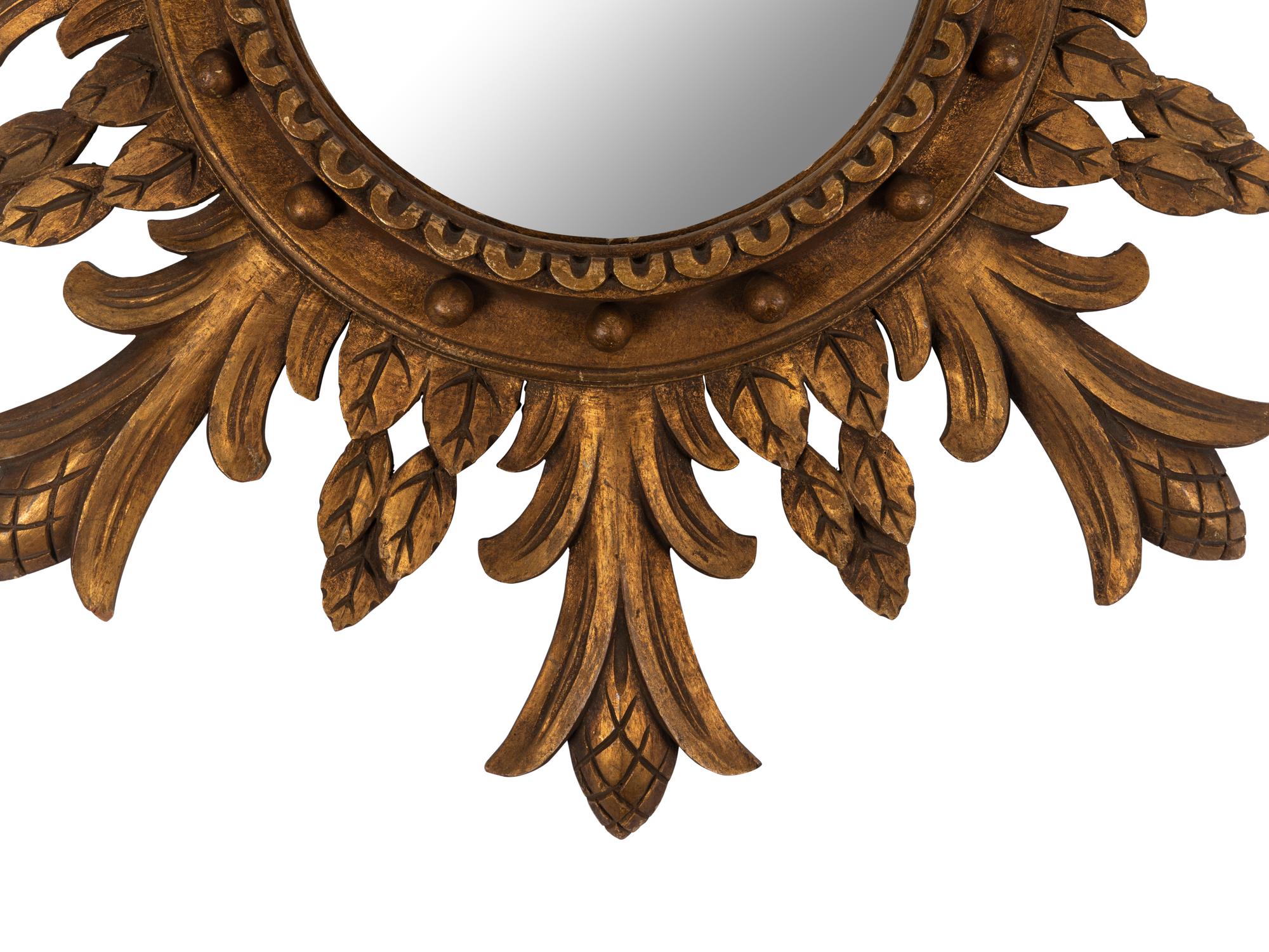 A Regency Style Carved Giltwood Sunburst Mirror