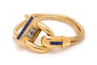 A Retro 18 Karat Yellow Gold and Sapphire 'Cadenas' Wristwatch, Van Cleef & Arpels, New York, 40.60 dwts.