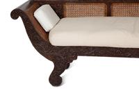 A British Colonial Carved Mahogany and Cane Work Settee