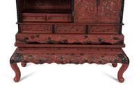 A Chinese Export Carved Red Lacquer Curio Cabinet — EARLY 20TH CENTURY