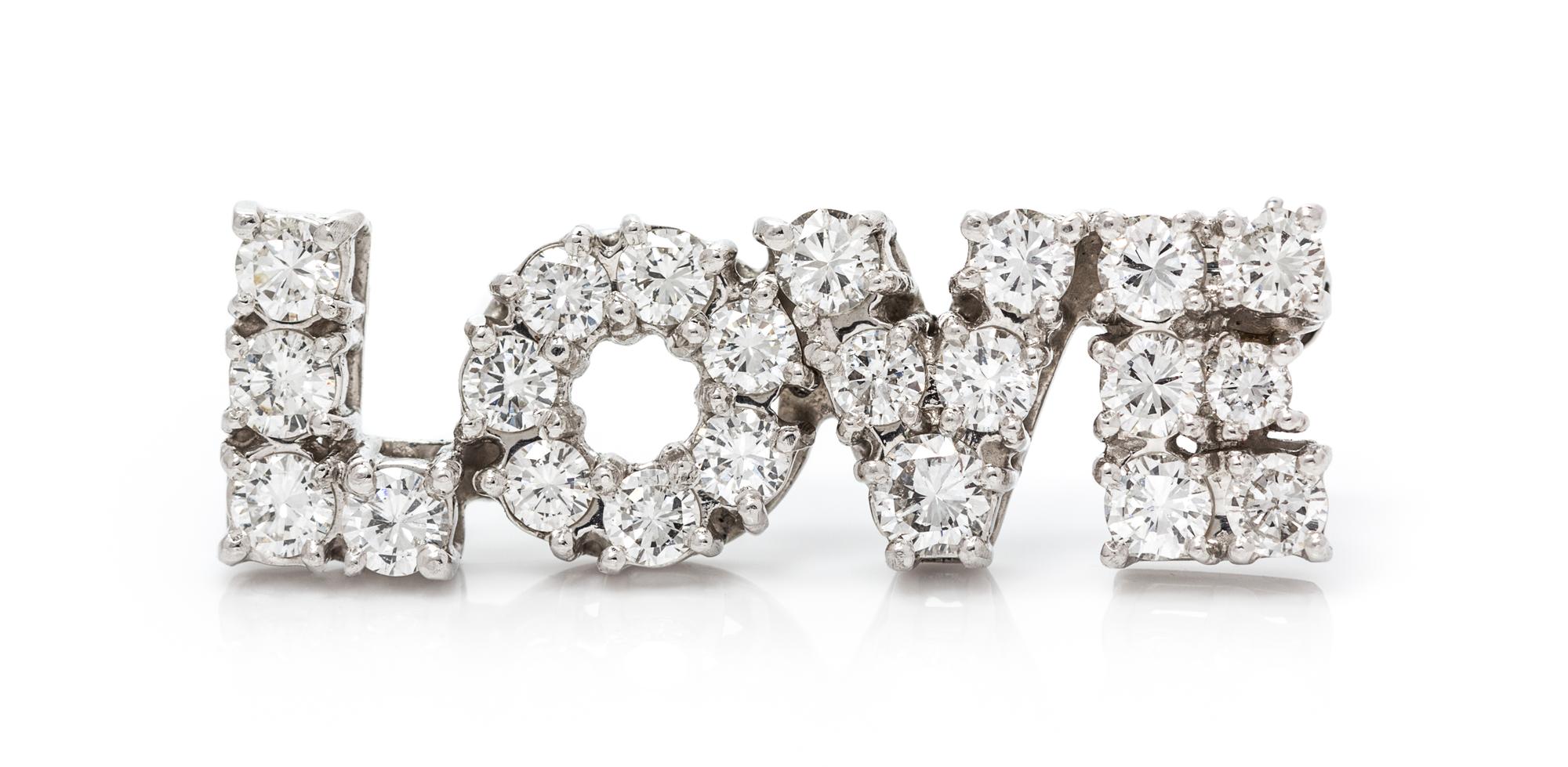A Platinum and Diamond "LOVE" Pin, 4.70 dwts.