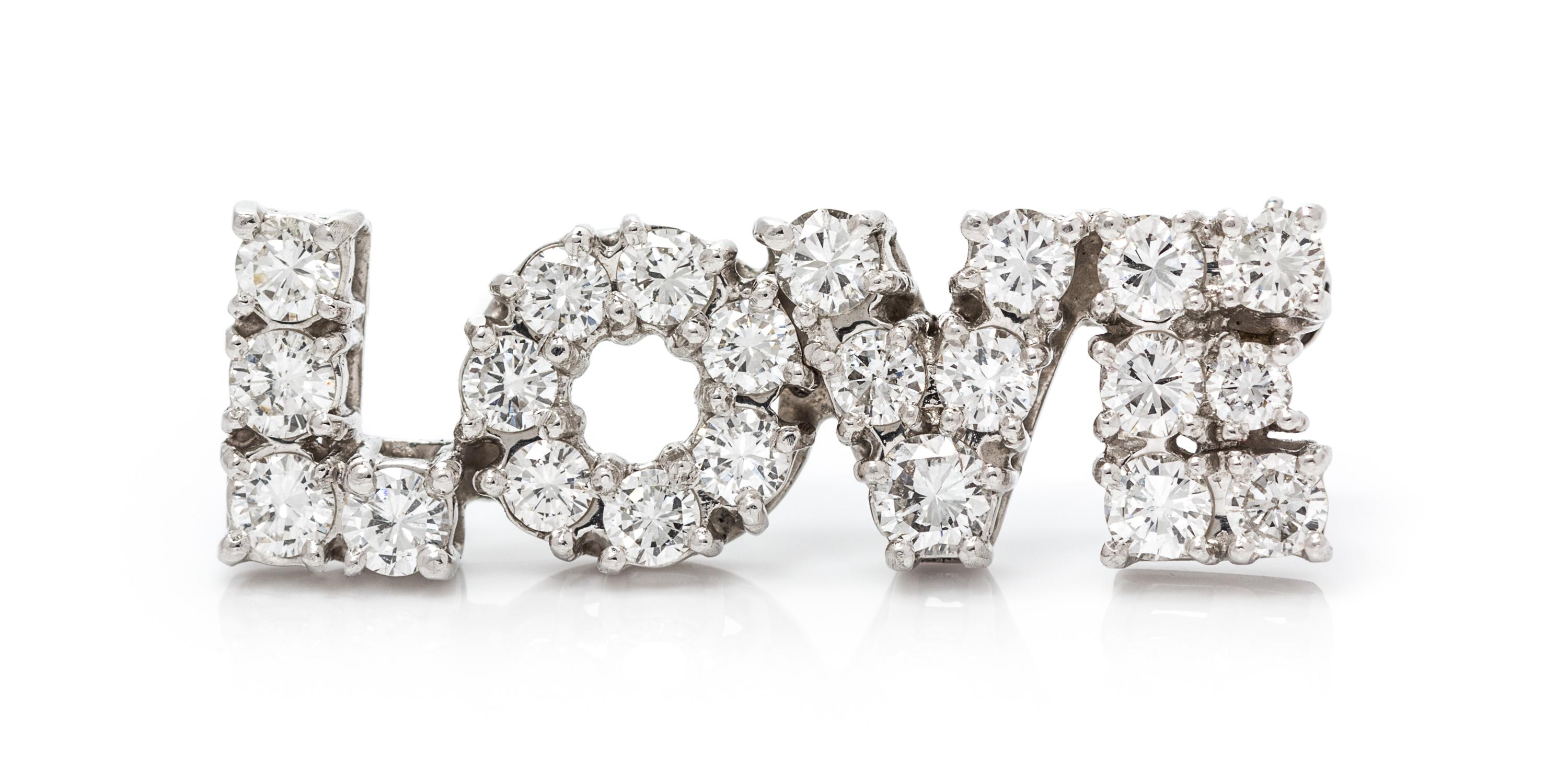 A Platinum and Diamond "LOVE" Pin, 4.70 dwts.