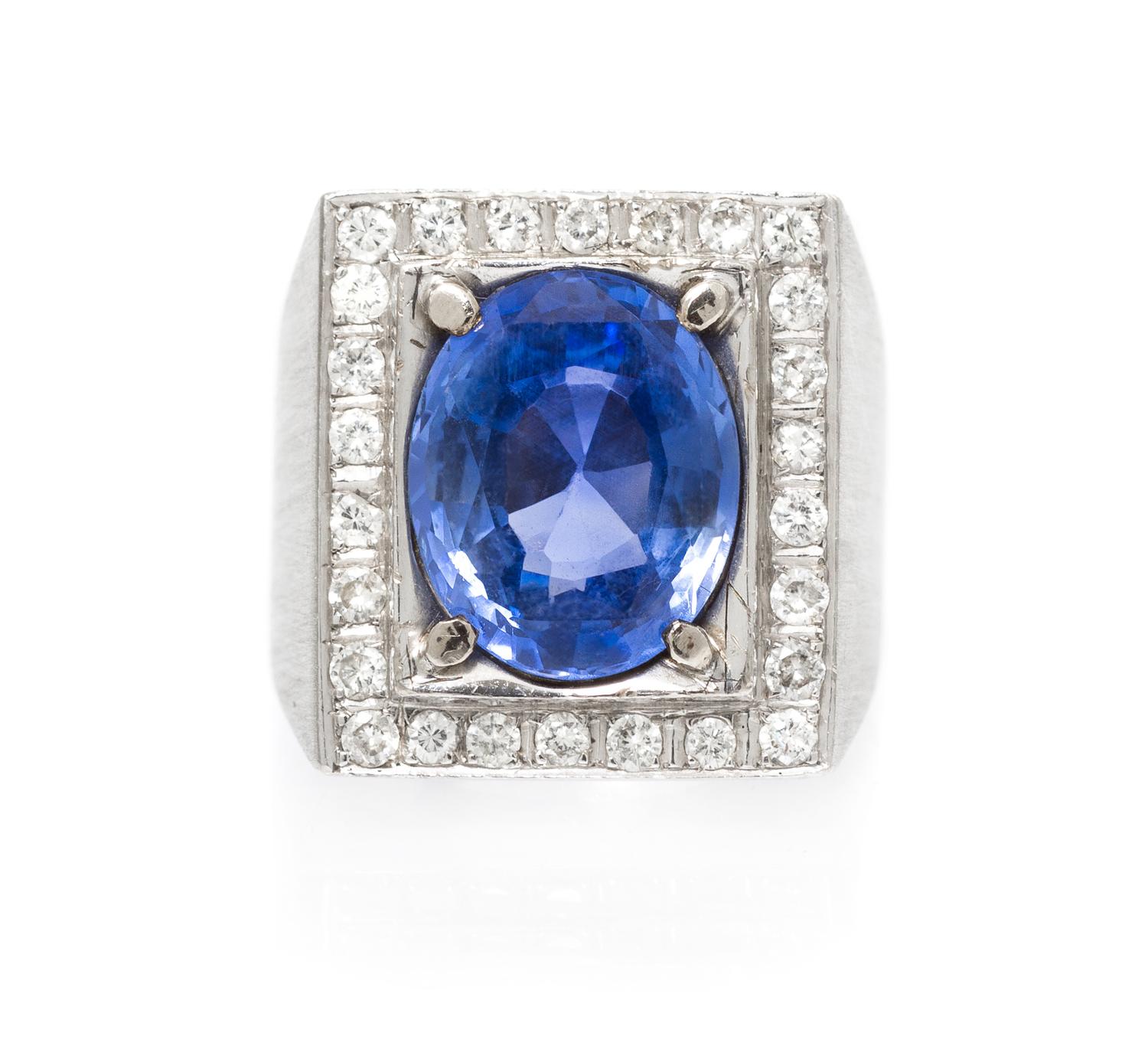 An 18 Karat White Gold, Sapphire and Diamond Ring, 8.30 dwts.