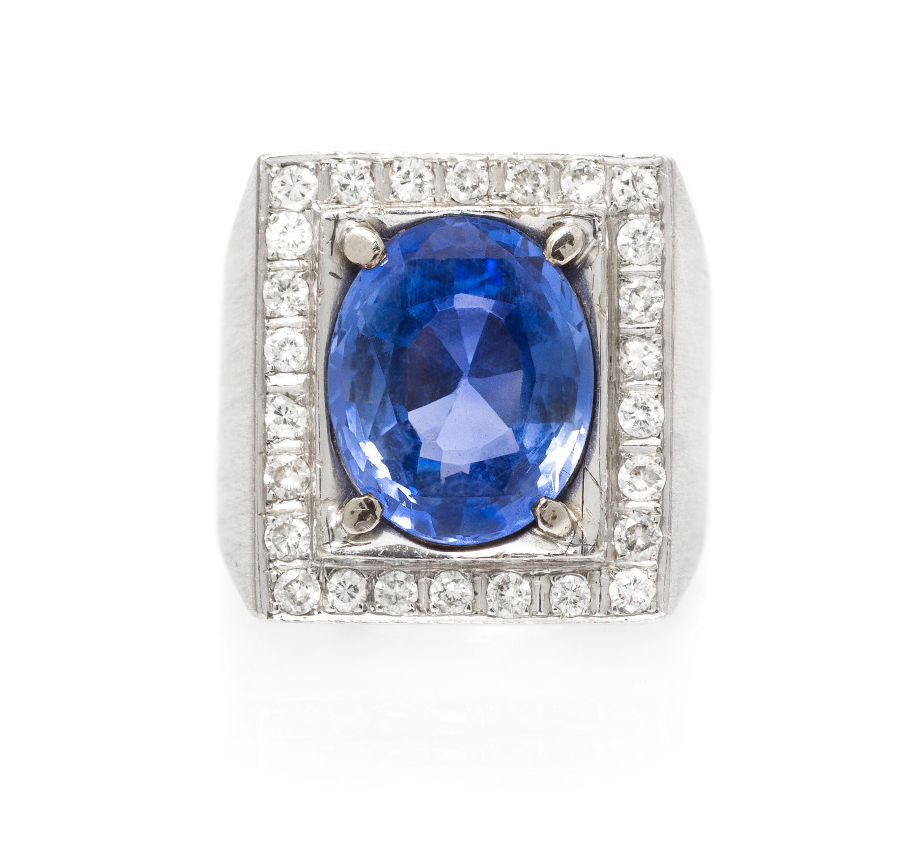 An 18 Karat White Gold, Sapphire and Diamond Ring, 8.30 dwts.