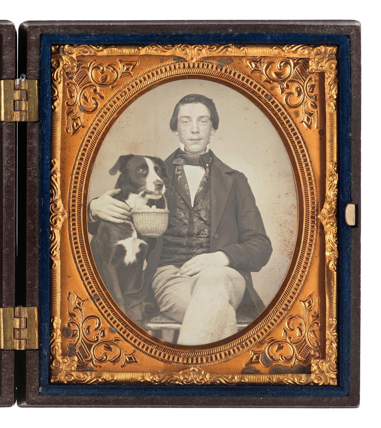 [EARLY PHOTOGRAPHY]. Sixth plate daguerreotype of a young man with his dog.