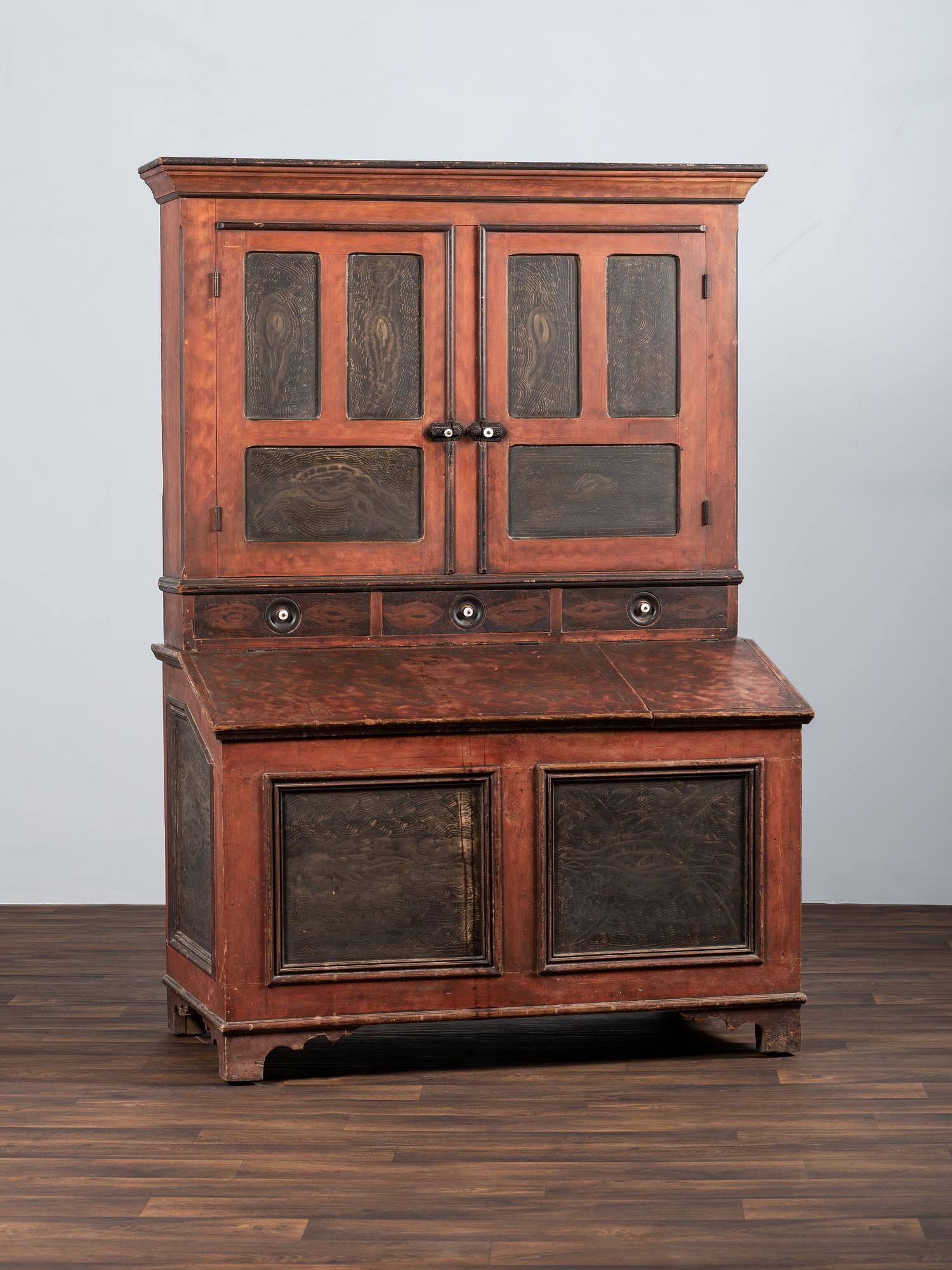 A Country Red and Grain Paint Decorated General Store Dry Goods Storage Cupboard