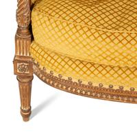 A Louis XVI Style Carved Beech Bergère