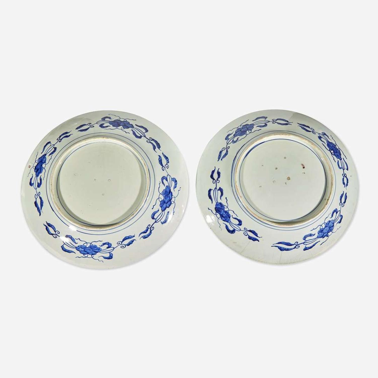 Three Massive Imari chargers The pair Meiji period, the third circa 1700-1725