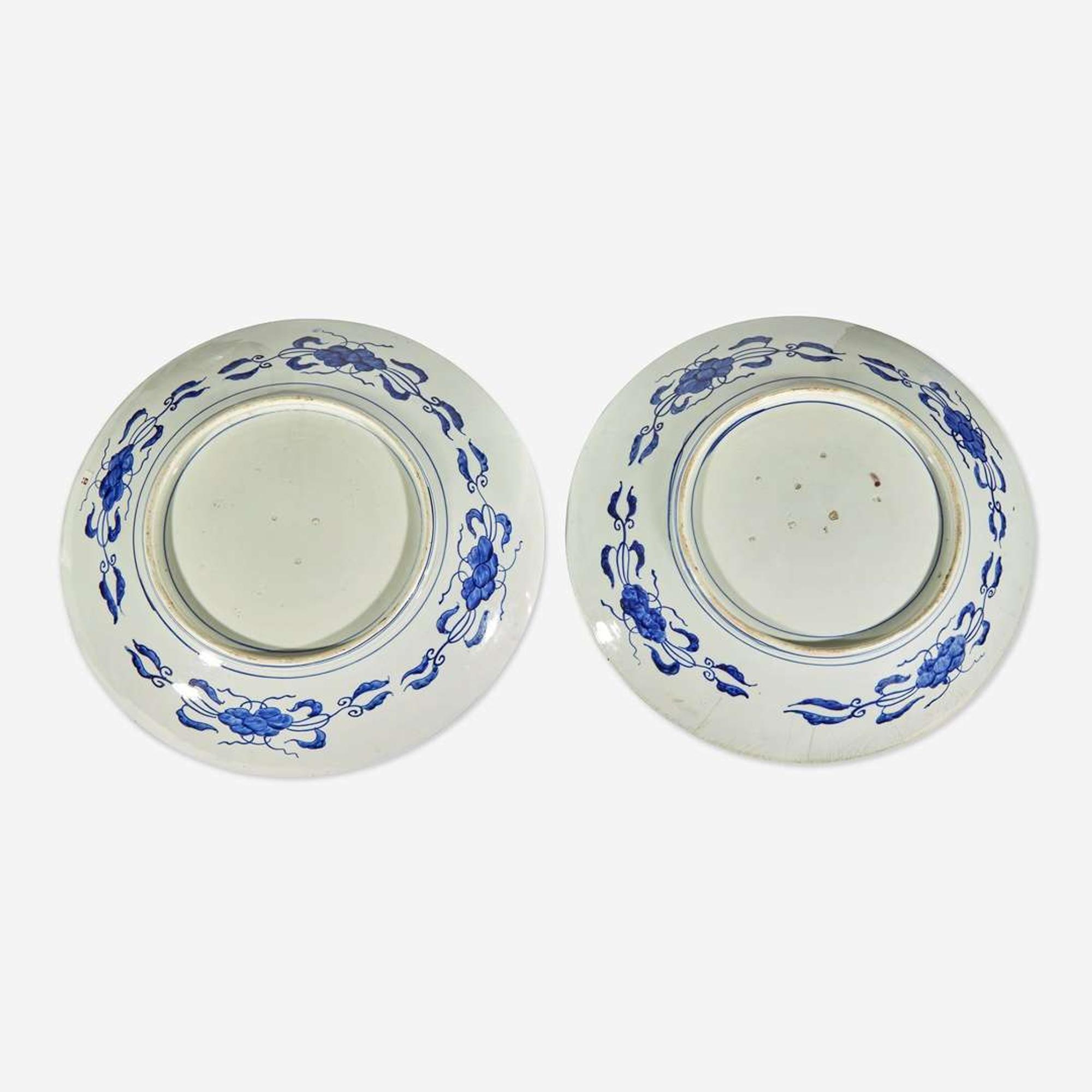 Three Massive Imari chargers The pair Meiji period, the third circa 1700-1725
