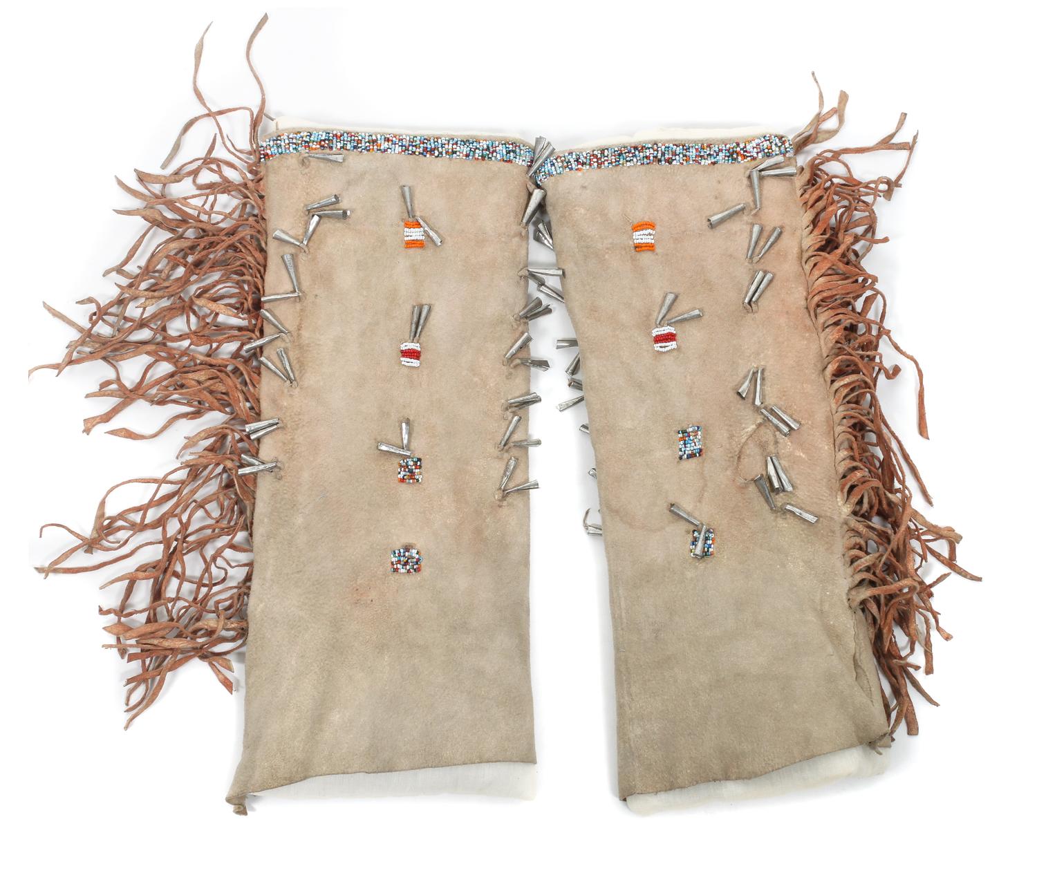 A Pair of Tall Jicarilla Apache Beaded Moccasins Height of first approximately 12 1/2 inches.