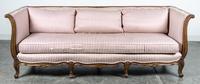 A Louis XV Style Walnut Sofa Height 29 1/2 x width 83 x depth 32 inches.