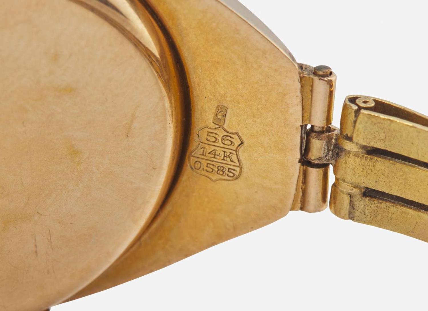 A Ladies 14K Yellow Gold Russian Invicta Watch with Diamonds