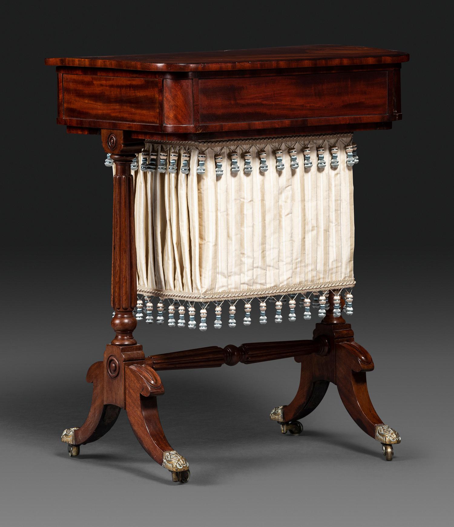 A Classical Figured Mahogany and Rosewood Veneered Sewing Table