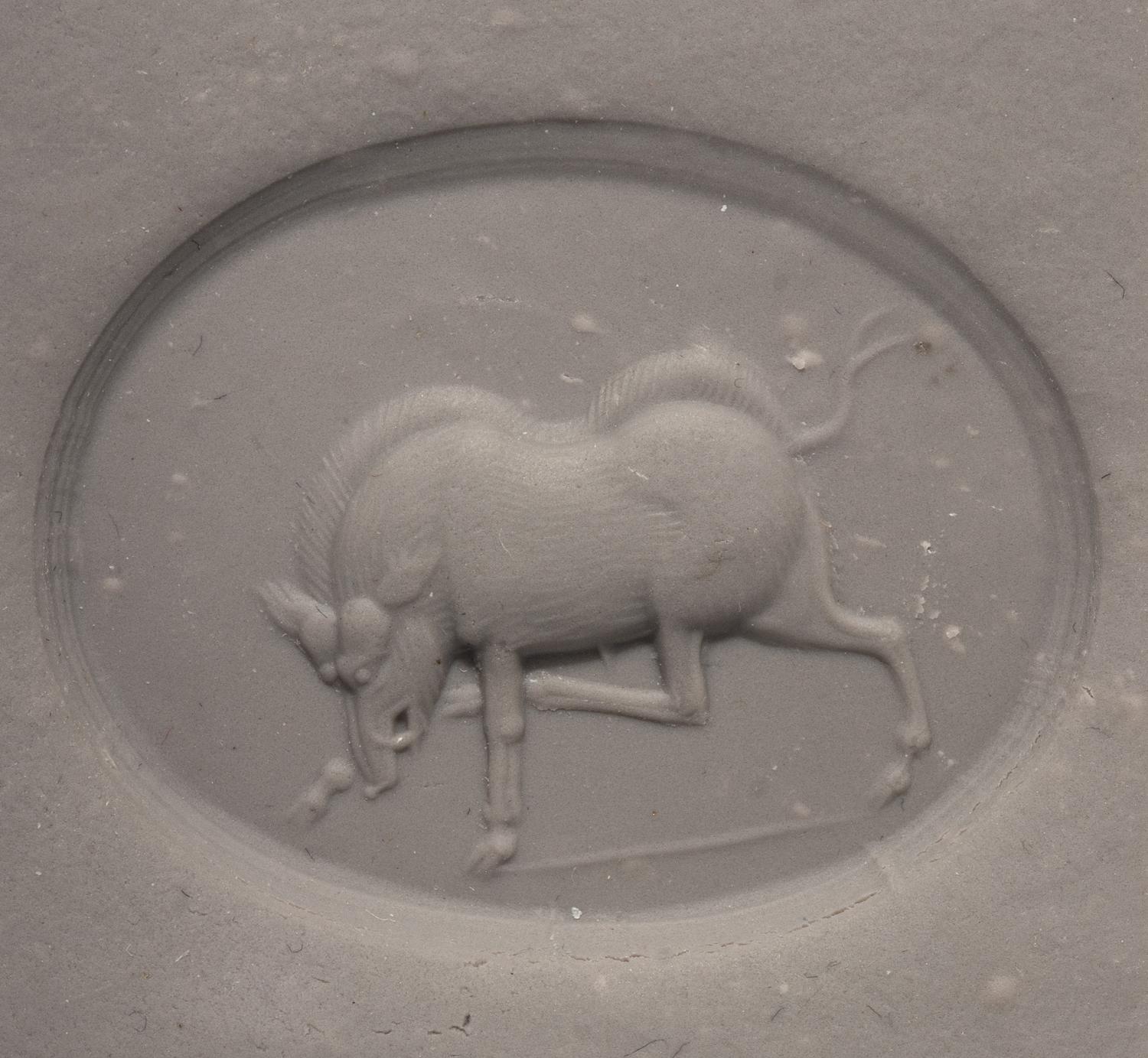 A Greco-Persian Chalcedony Scaraboid with a Charging Boar