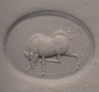 A Greco-Persian Chalcedony Scaraboid with a Charging Boar