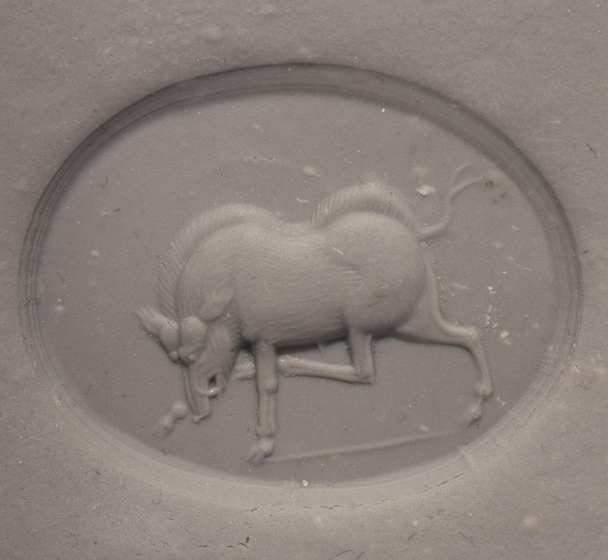 A Greco-Persian Chalcedony Scaraboid with a Charging Boar