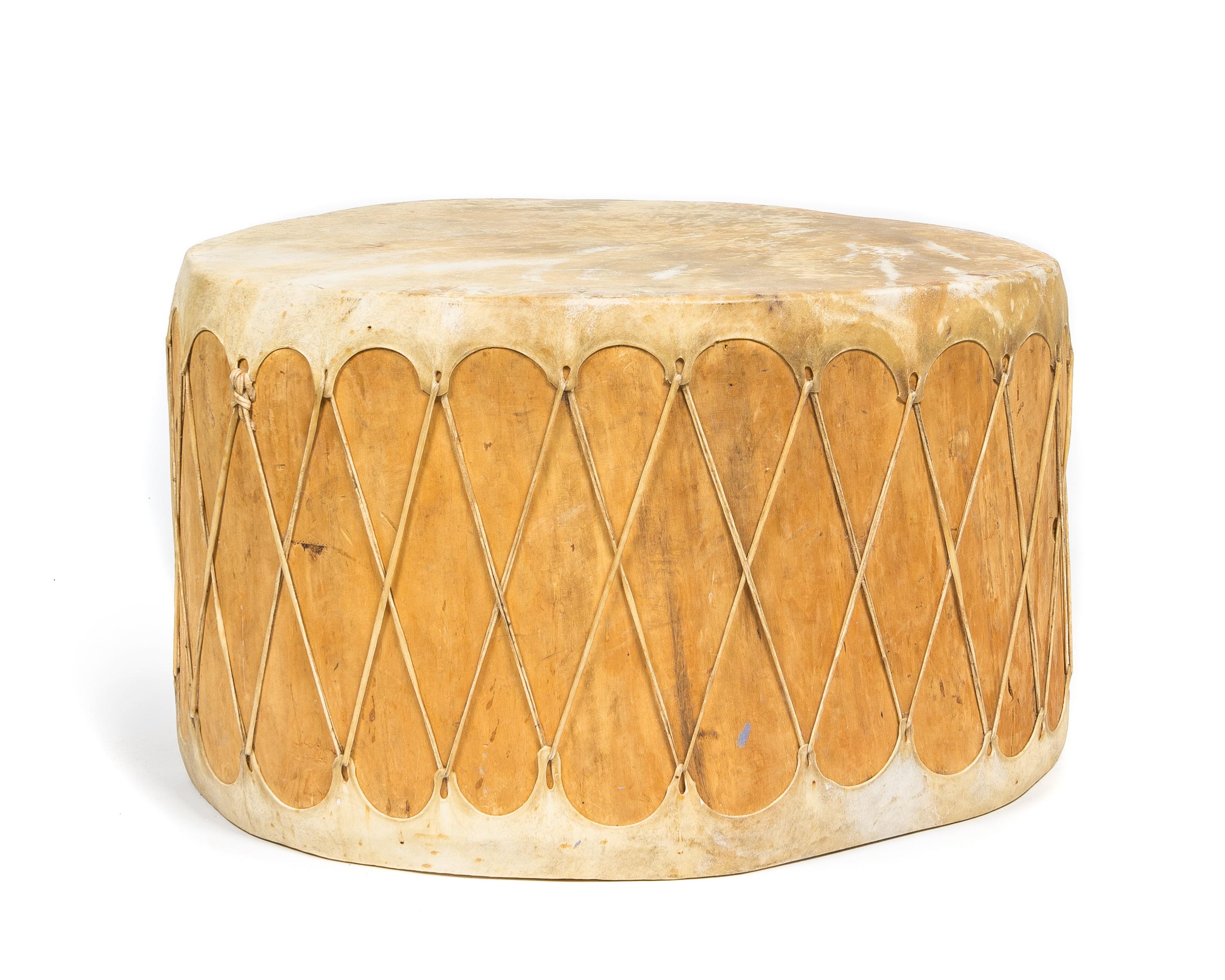 A Southwestern Hide and Wood Drum Height 18 1/4 x diameter approx. 29 1/2 inches.