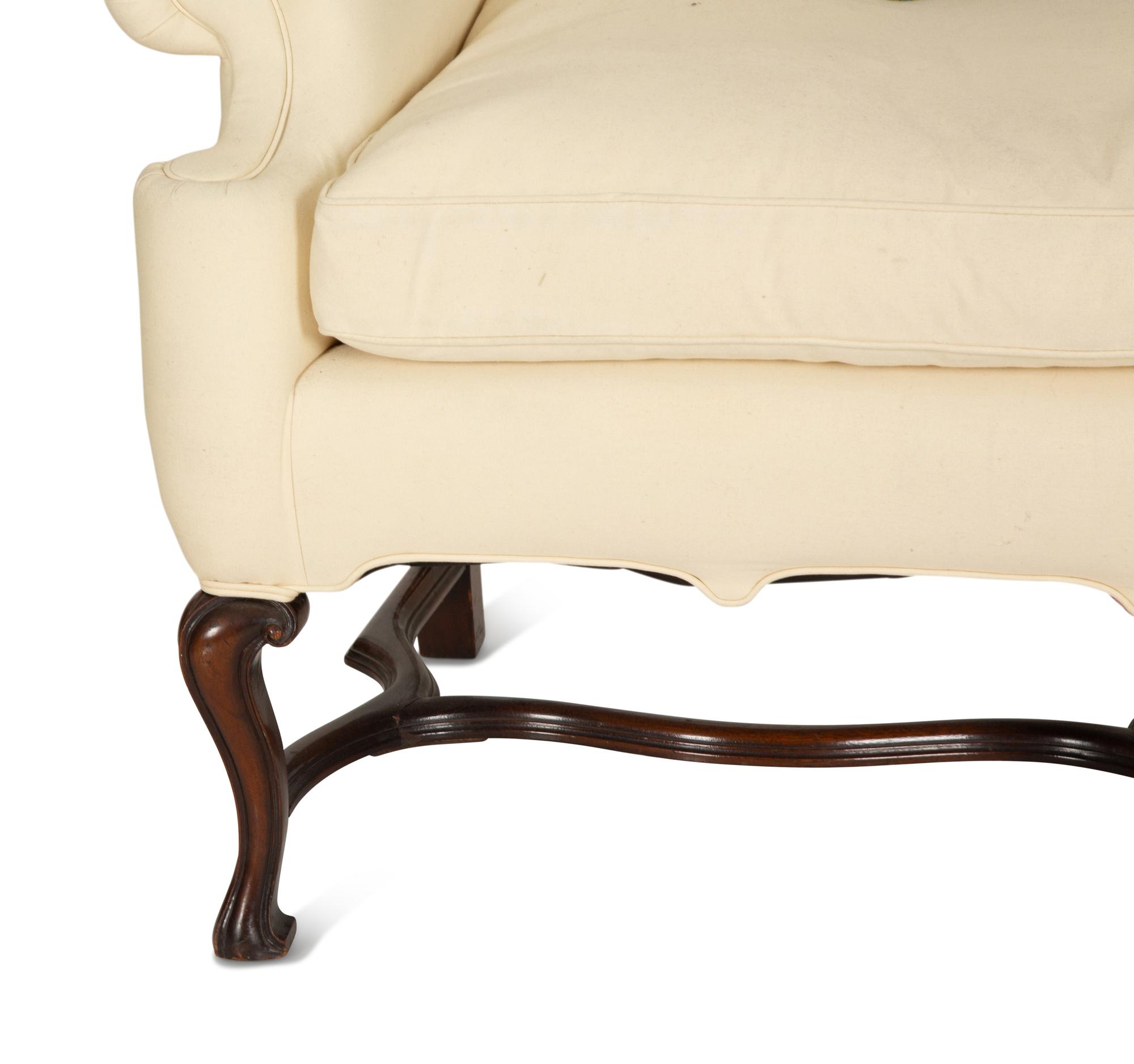 A William & Mary Style Carved Oak Upholstered Wing Back Settee