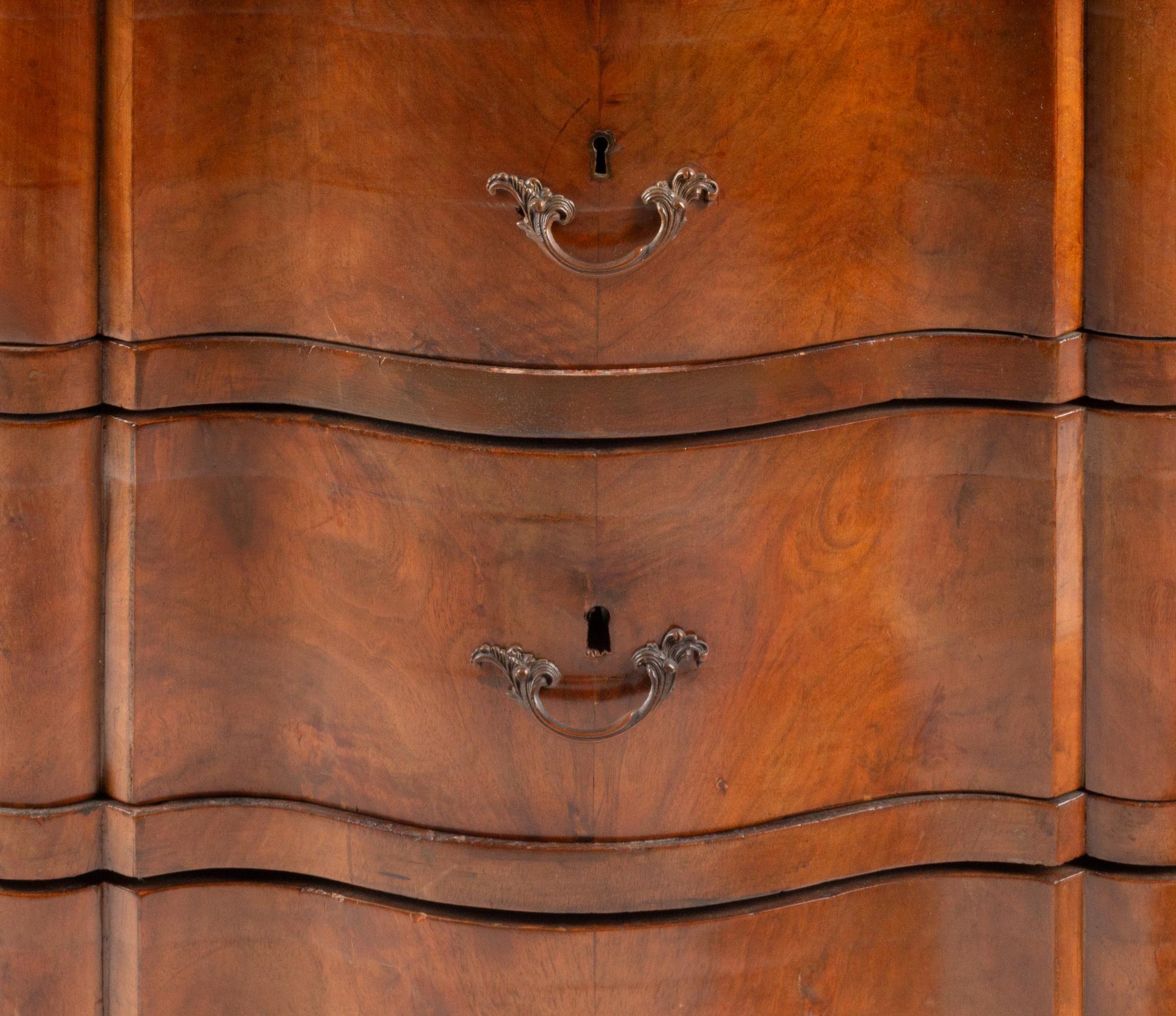An Italian Walnut Three-Drawer Commode
