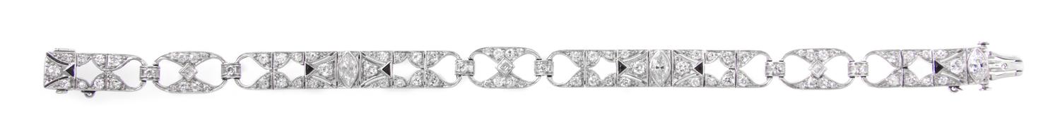 An Art Deco Platinum, Diamond and Onyx Open Link Bracelet, 12.60 dwts.