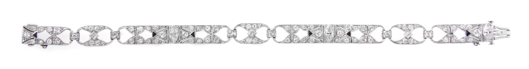 An Art Deco Platinum, Diamond and Onyx Open Link Bracelet, 12.60 dwts.