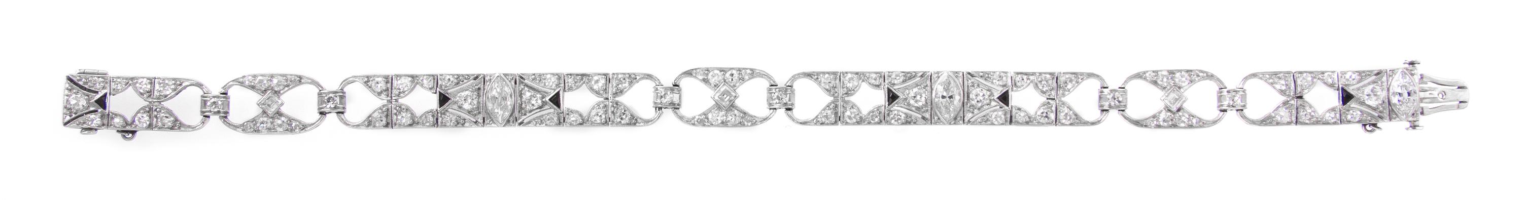 An Art Deco Platinum, Diamond and Onyx Open Link Bracelet, 12.60 dwts.