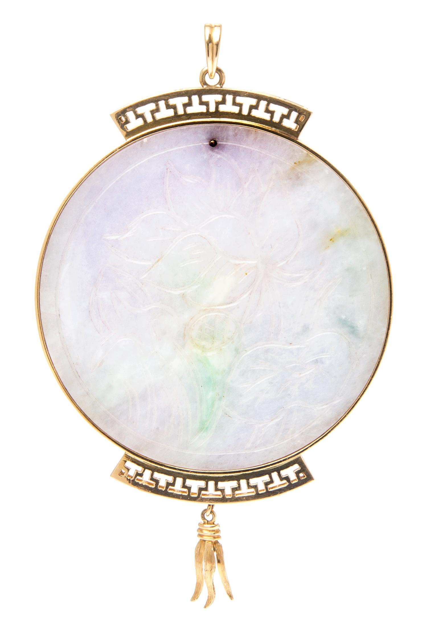 A 14 Karat Yellow Gold and Jade Pendant,