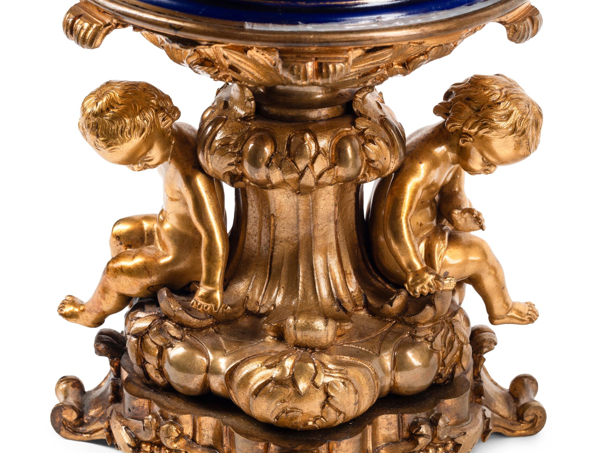 A Pair of Gilt Bronze Mounted Sèvres Style Porcelain Cache Pots
