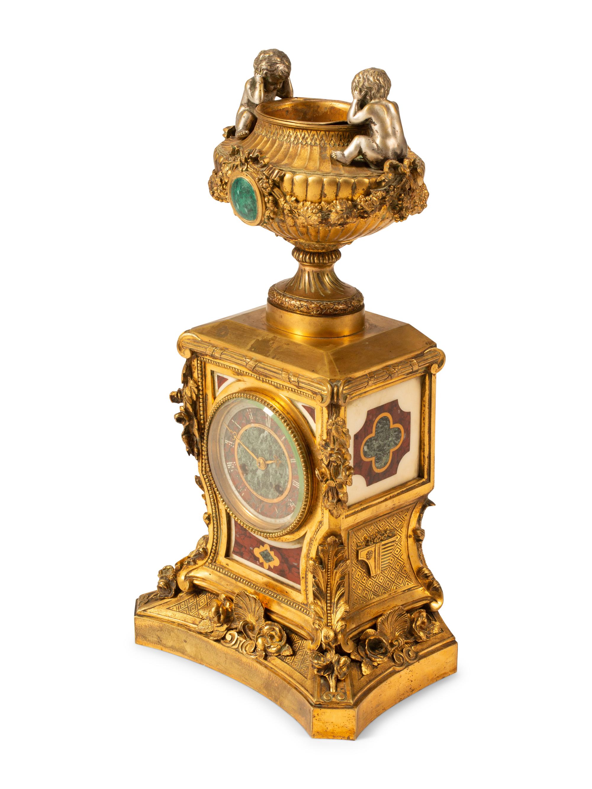 A French Gilt Bronze and Specimen Marble Clock