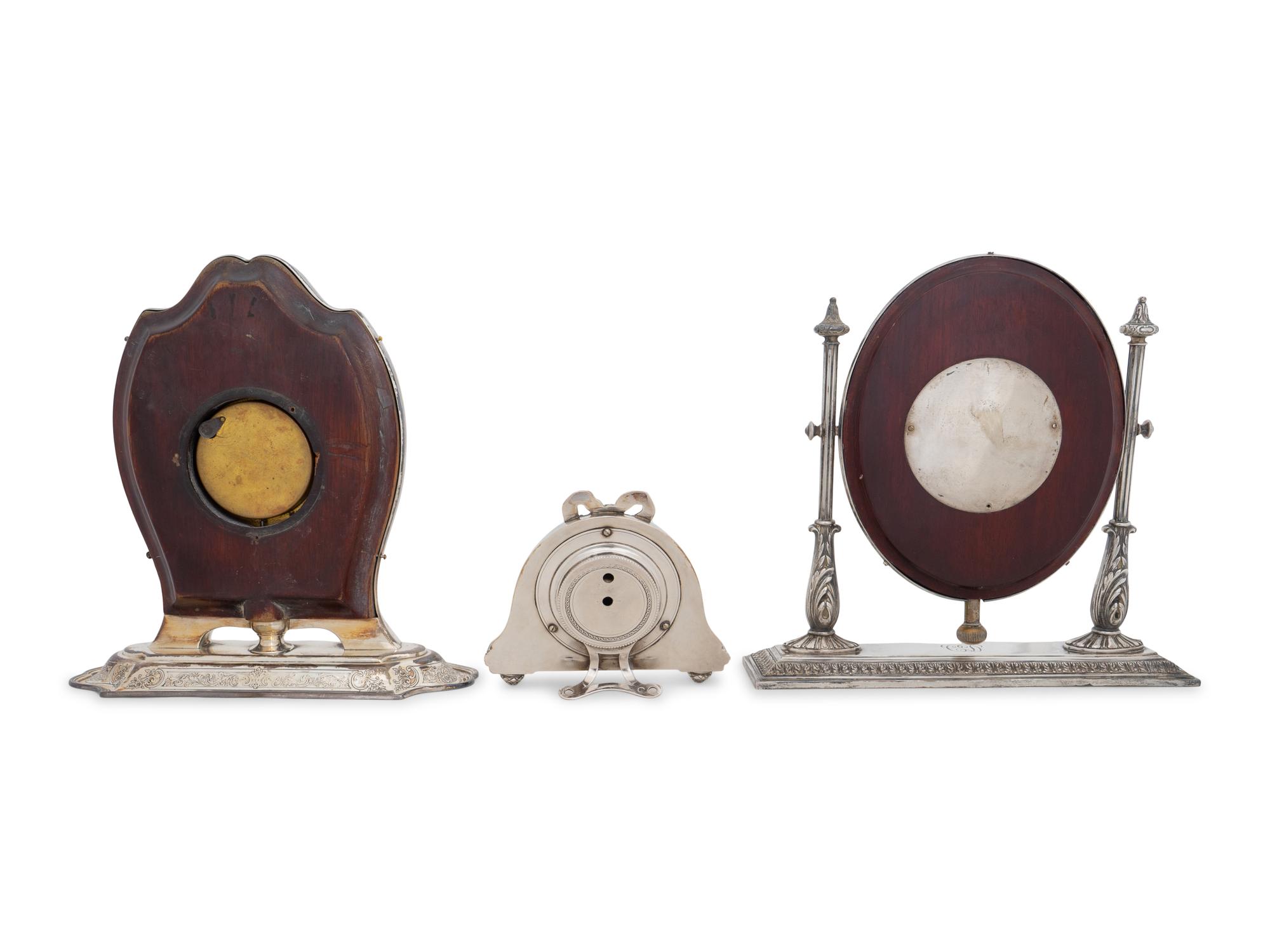 A Collection of Three Silver Desk Clocks
