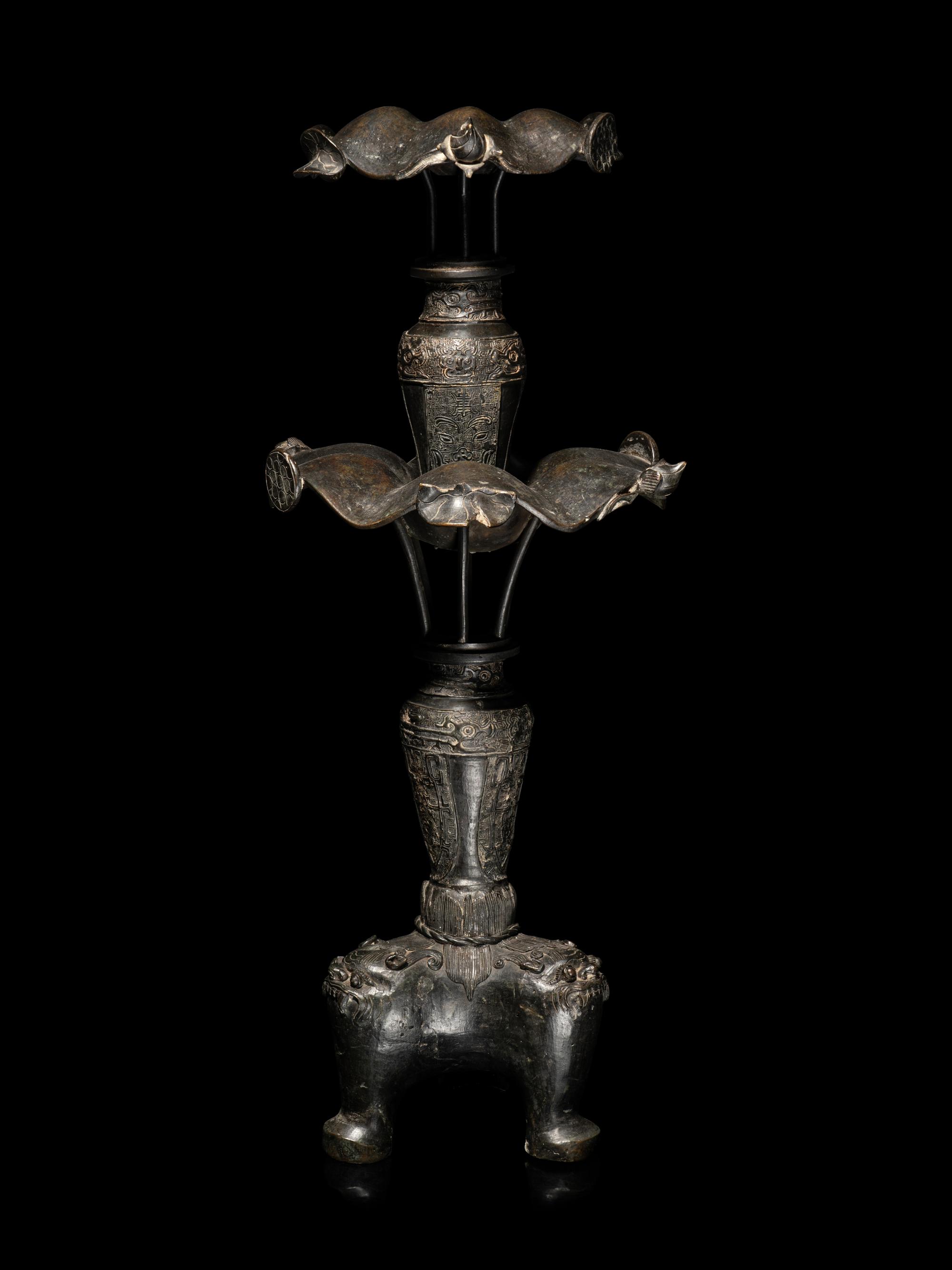 A Large Pair of Bronze Candle Holders