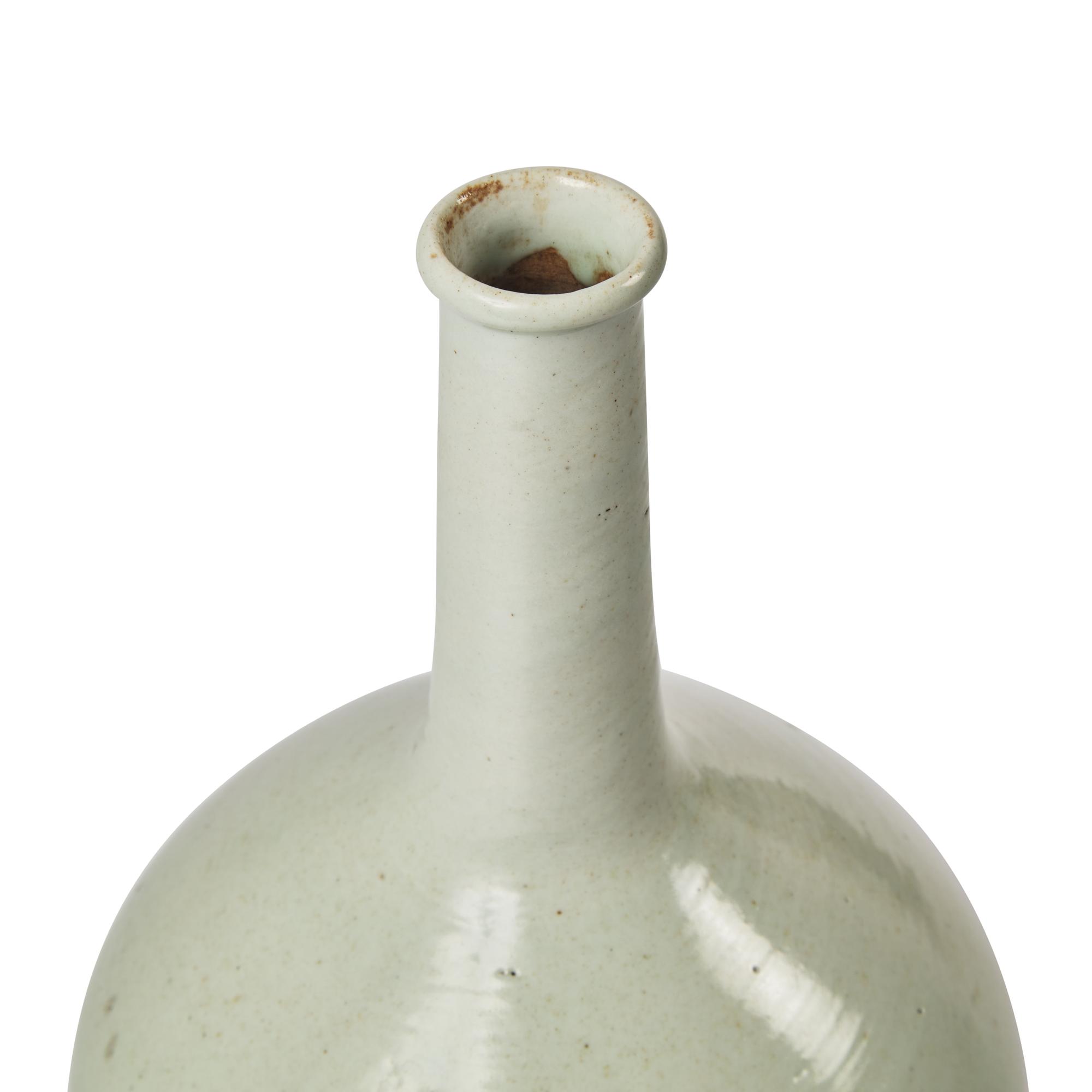 A Korean White Glazed Porcelain Tall-Neck Bottle Vase, Joseon Dynasty, 18th Century