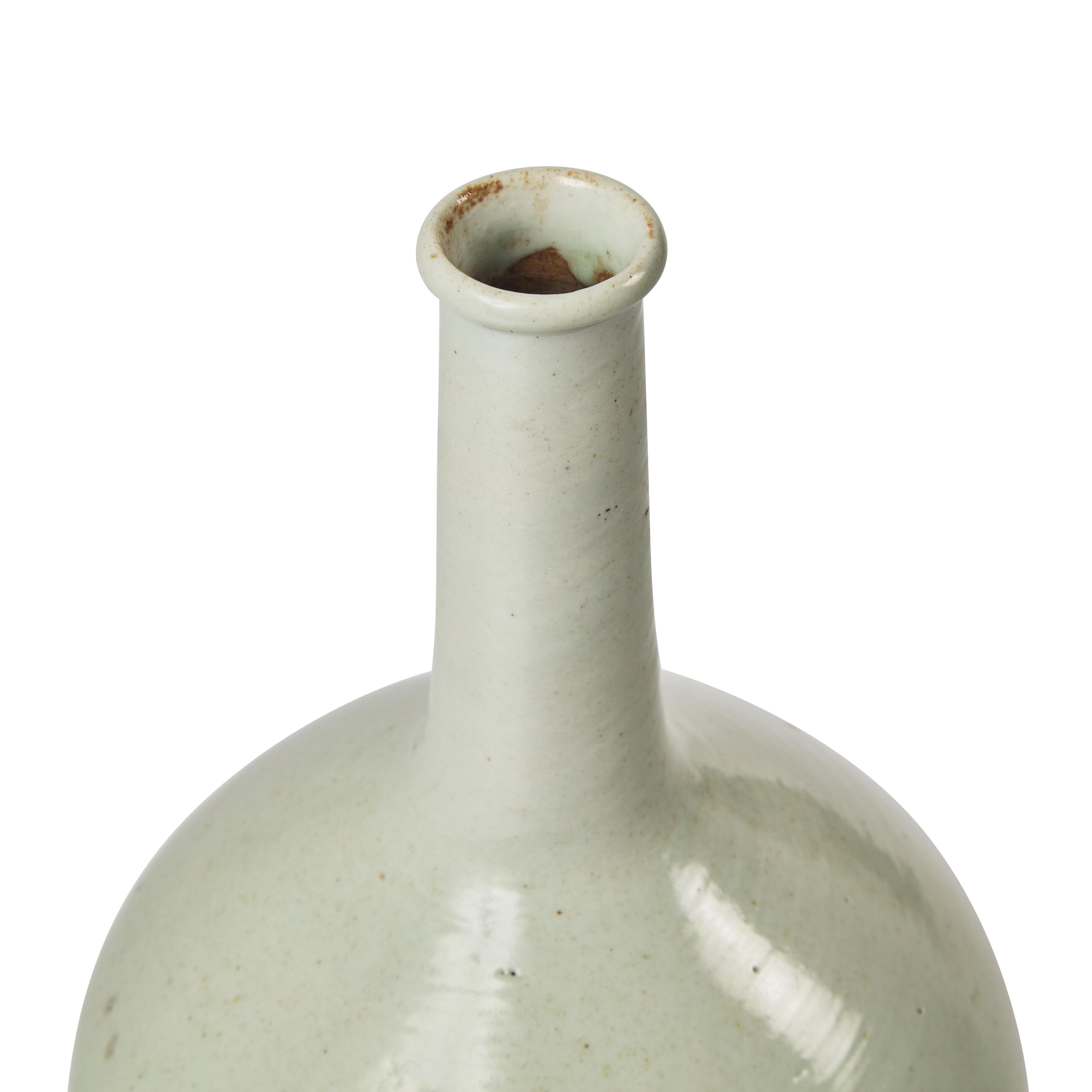 A Korean White Glazed Porcelain Tall-Neck Bottle Vase, Joseon Dynasty, 18th Century