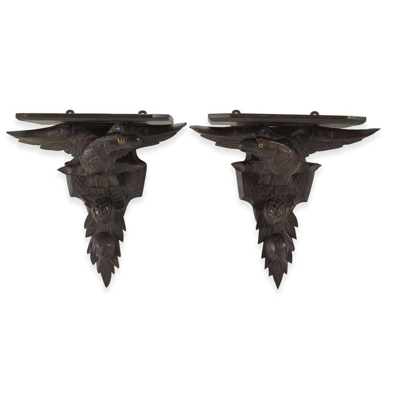 Pair of carved oak wall brackets in the form of eagles above fruiting branches late 19th century