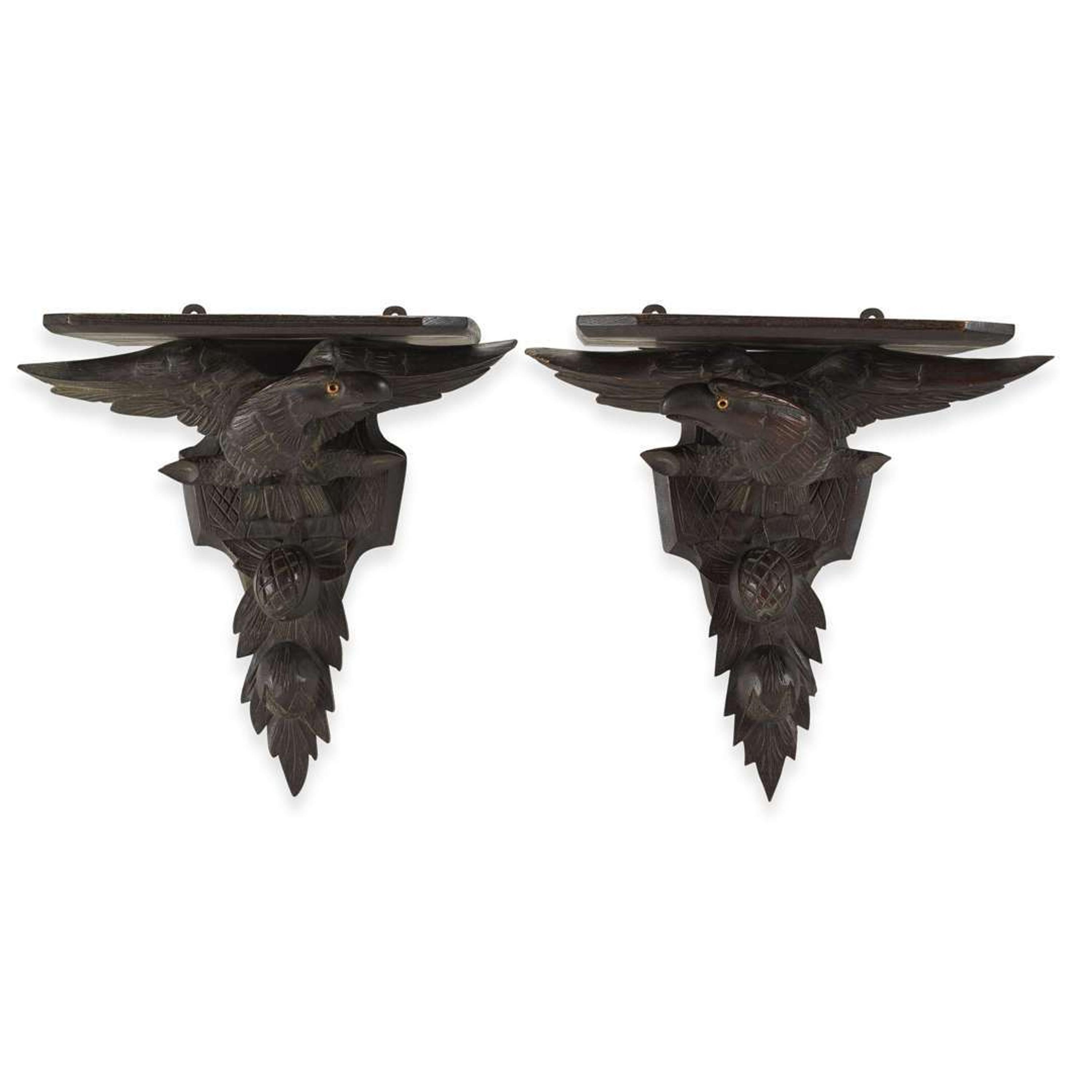 Pair of carved oak wall brackets in the form of eagles above fruiting branches late 19th century