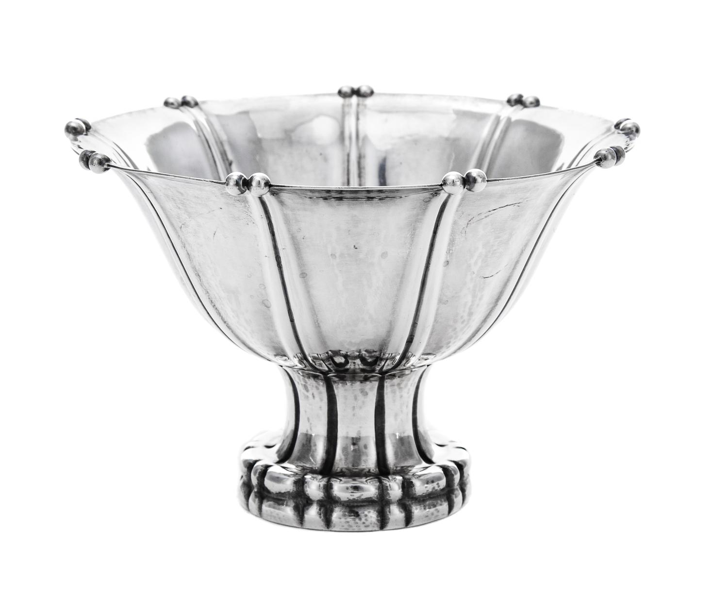 A Danish Silver Compote, Georg Jensen Silversmithy, Copenhagen, Circa 1925, the tapered circular bowl with a knopped rim and raised on