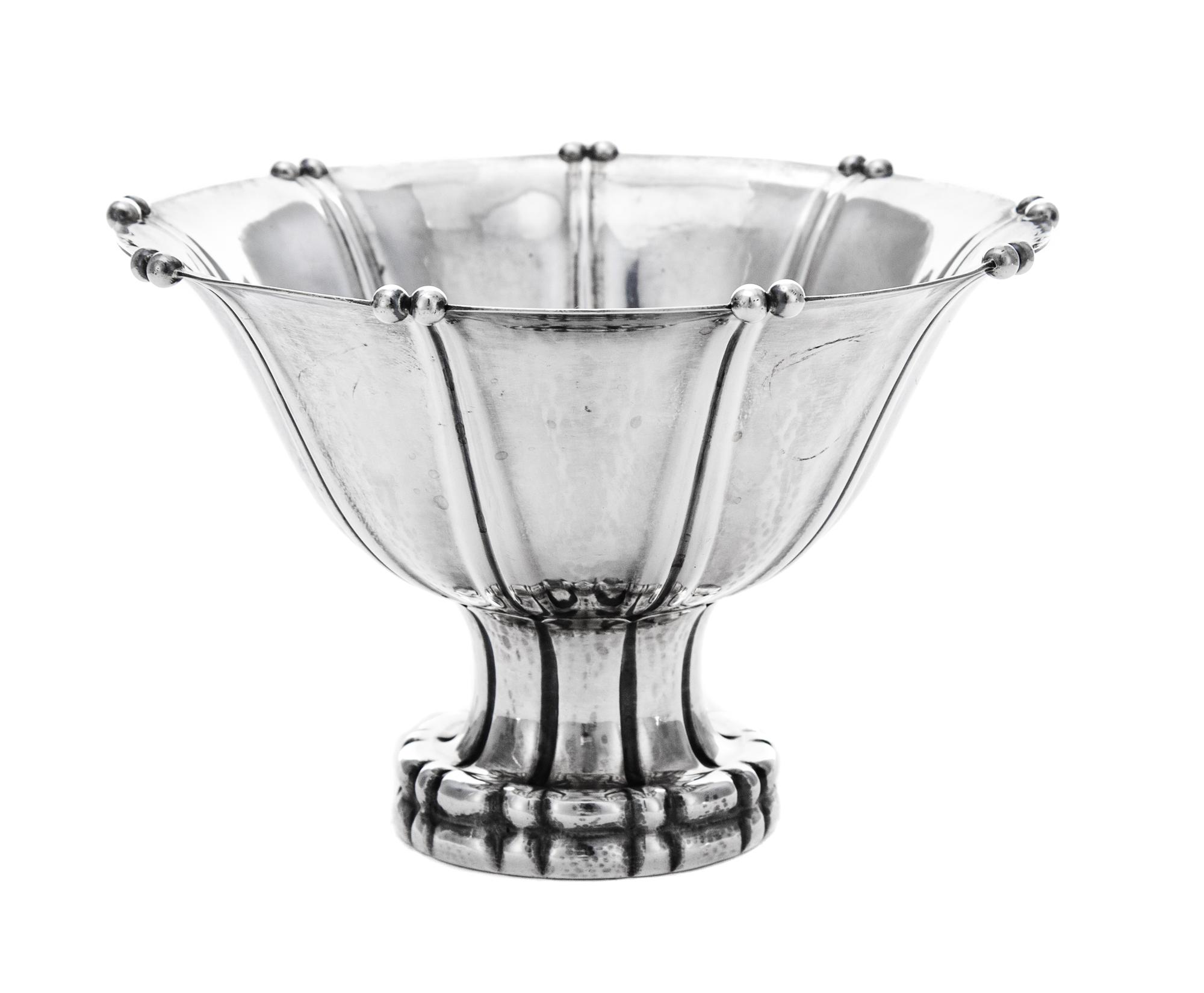 A Danish Silver Compote, Georg Jensen Silversmithy, Copenhagen, Circa 1925, the tapered circular bowl with a knopped rim and raised on