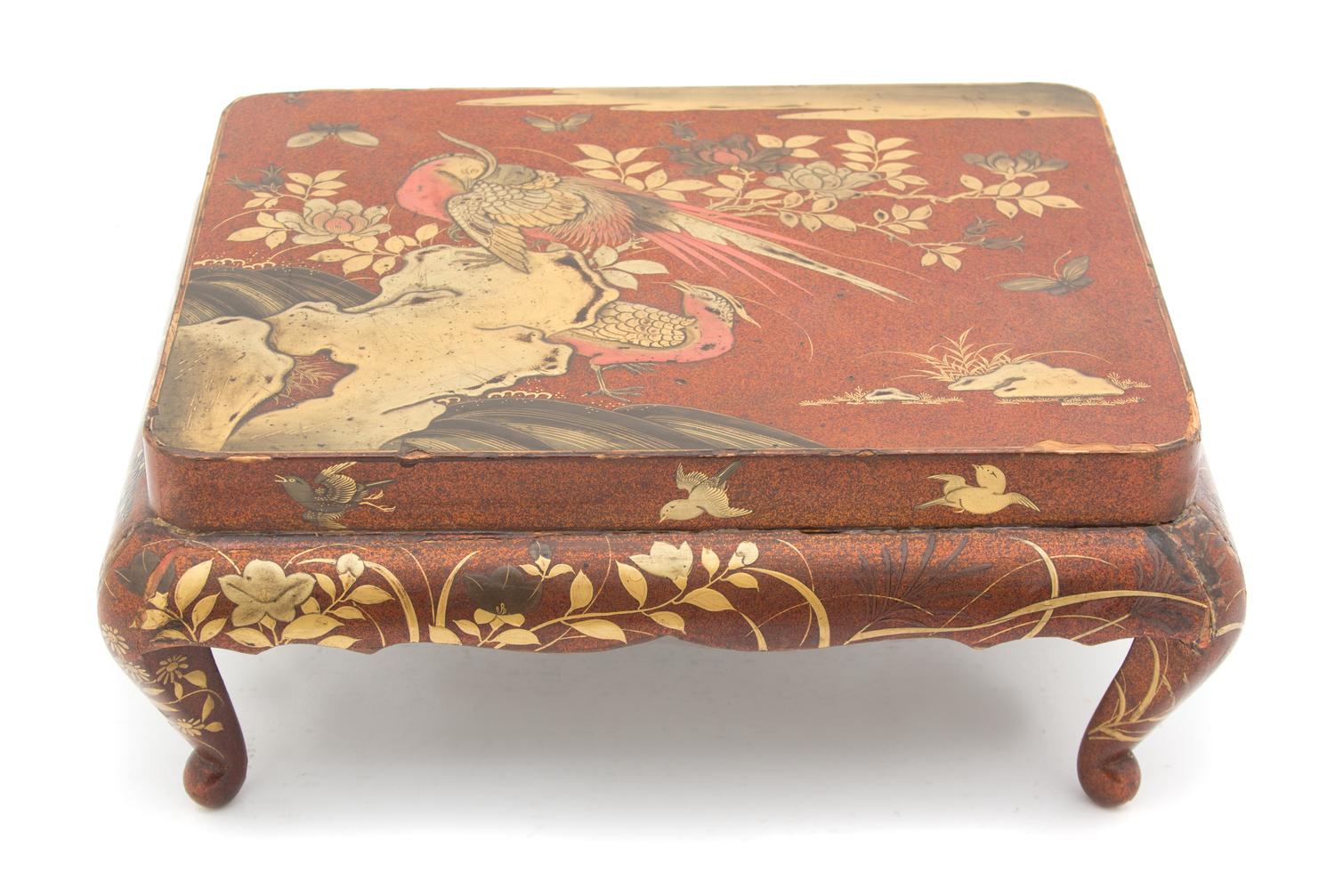 A Japanese Red and Gilt Lacquer Miniature Presentation Table Height 4 1/2 x width 10 7/8 x depth 8 7/8 inches. — 20TH CENTURY