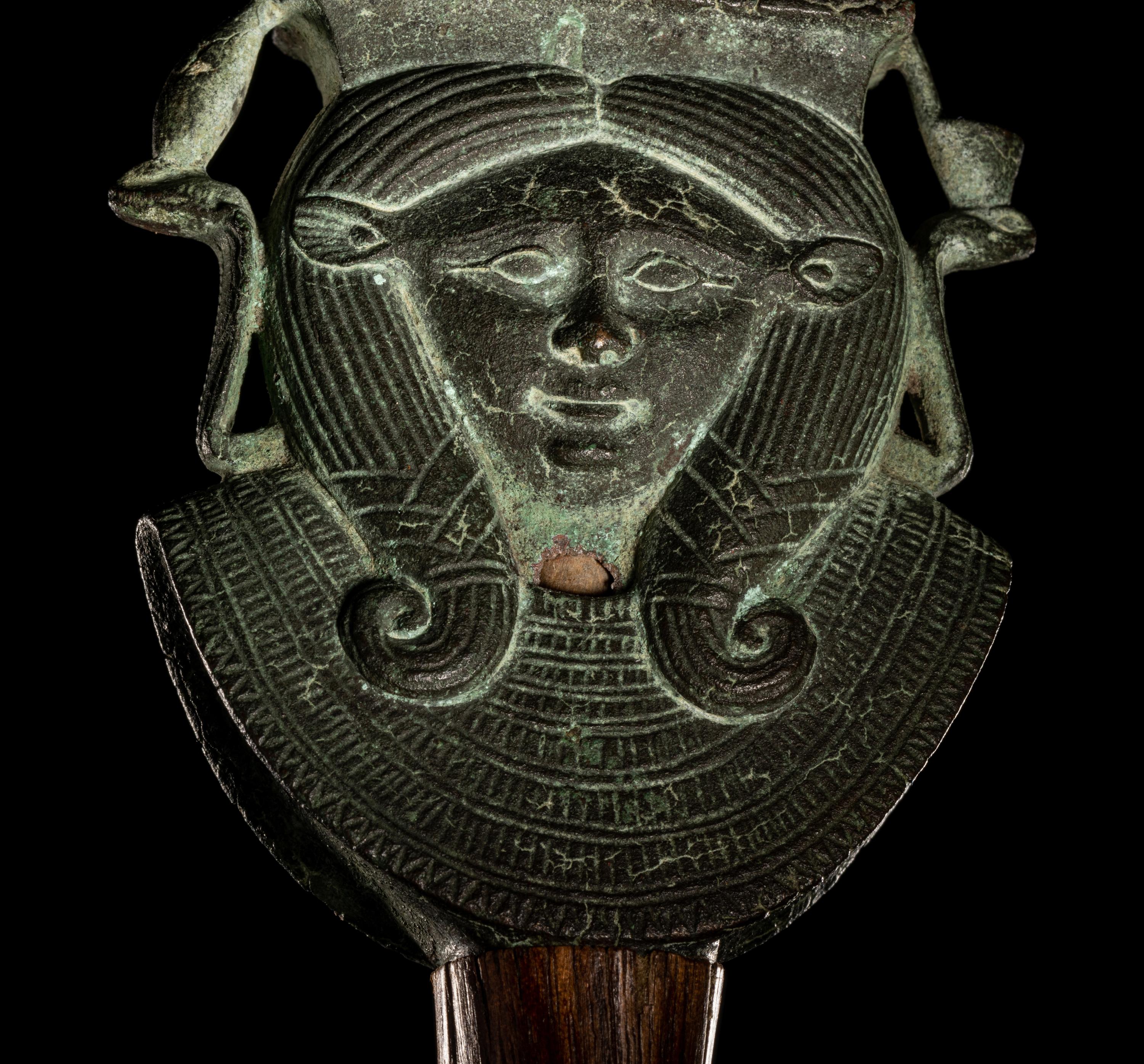 An Egyptian Bronze Hathor Sistrum Terminal