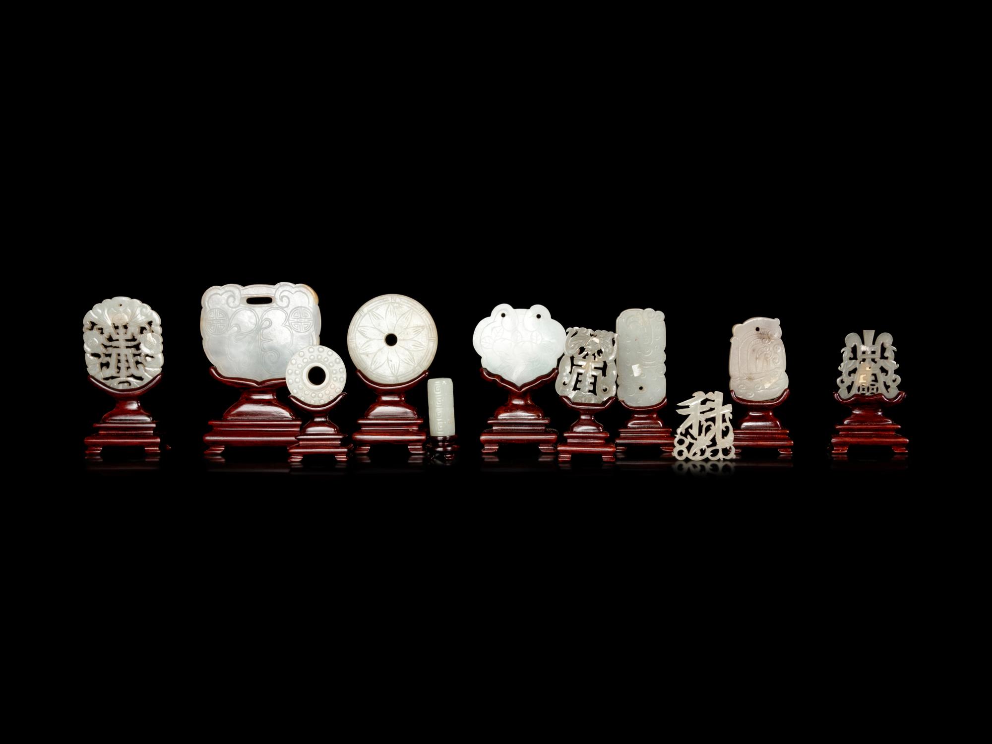 Eleven Chinese Carved and Reticulated Jade Plaques