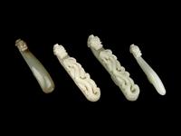 Four Chinese Carved Celadon Jade Belt Hooks