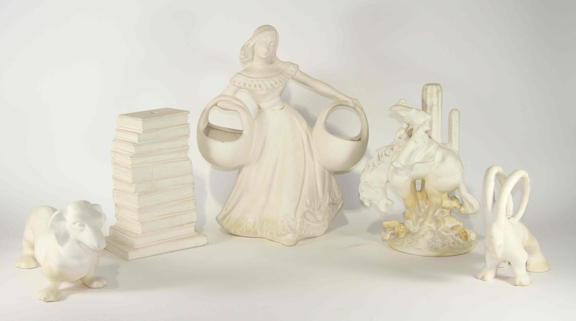 A Group of Ten Unglazed Haeger Pottery Articles Height of tallest 16 3/4 inches.