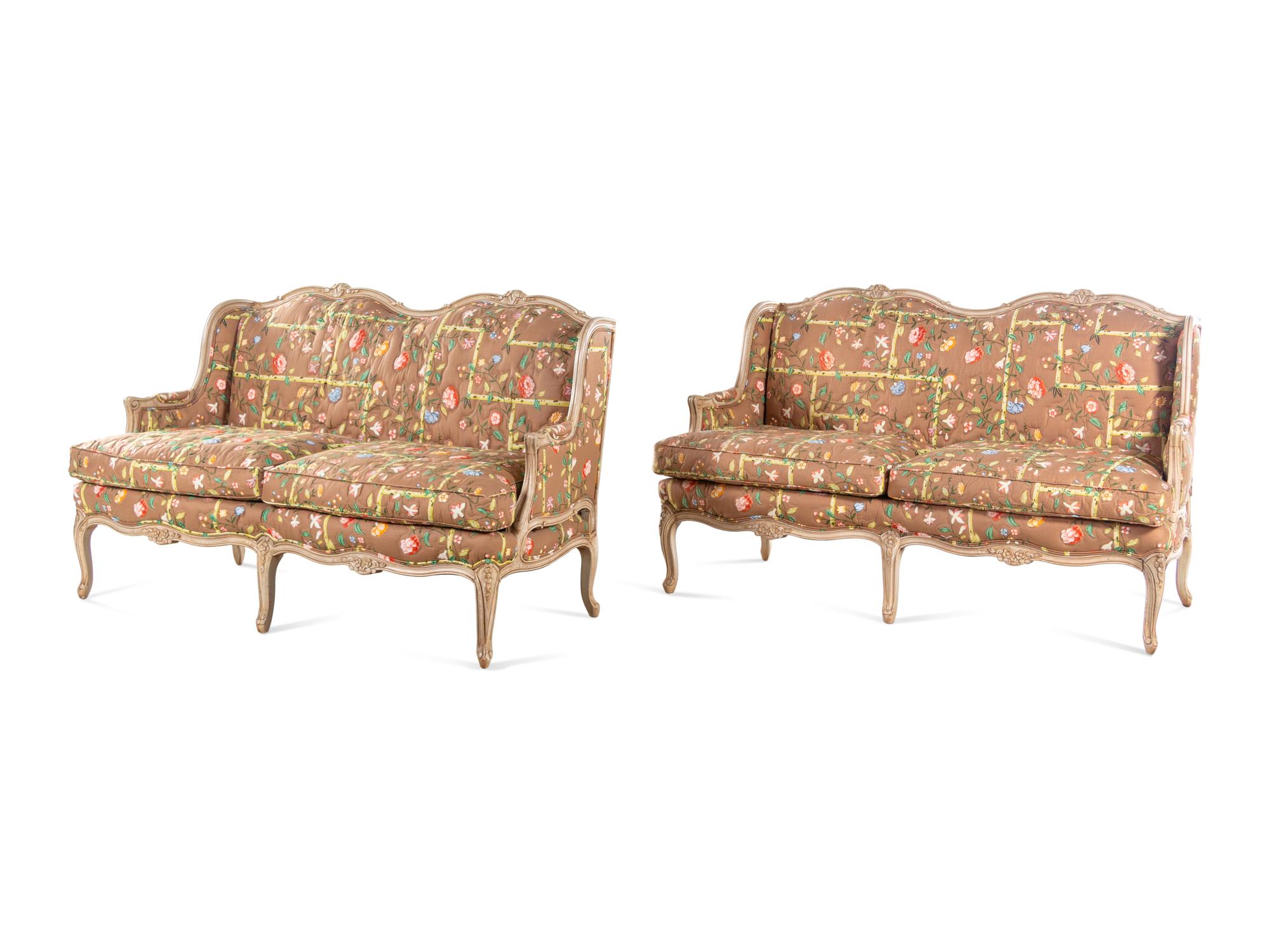 A Pair of Louis XV Style Painted Sofas