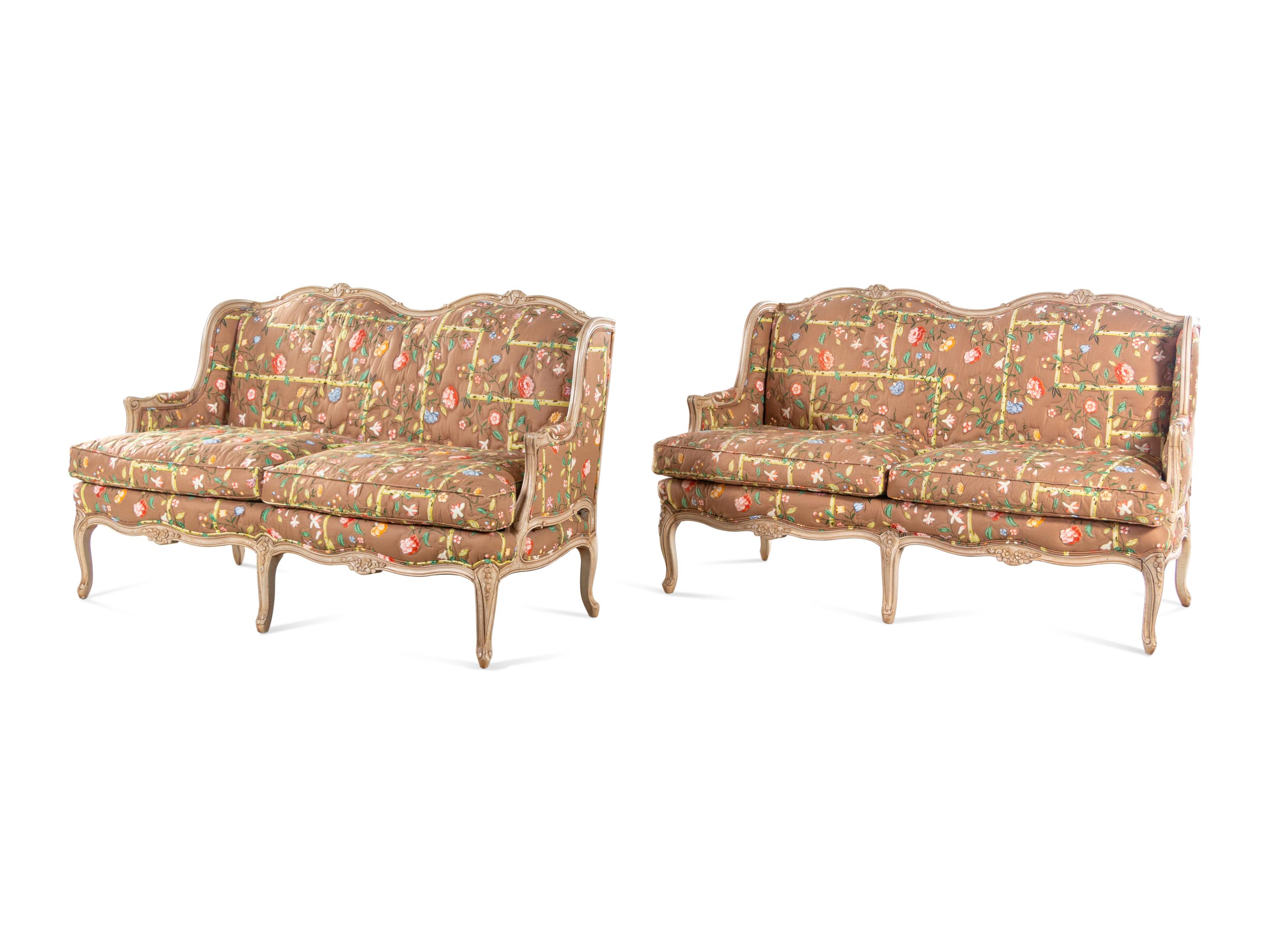 A Pair of Louis XV Style Painted Sofas