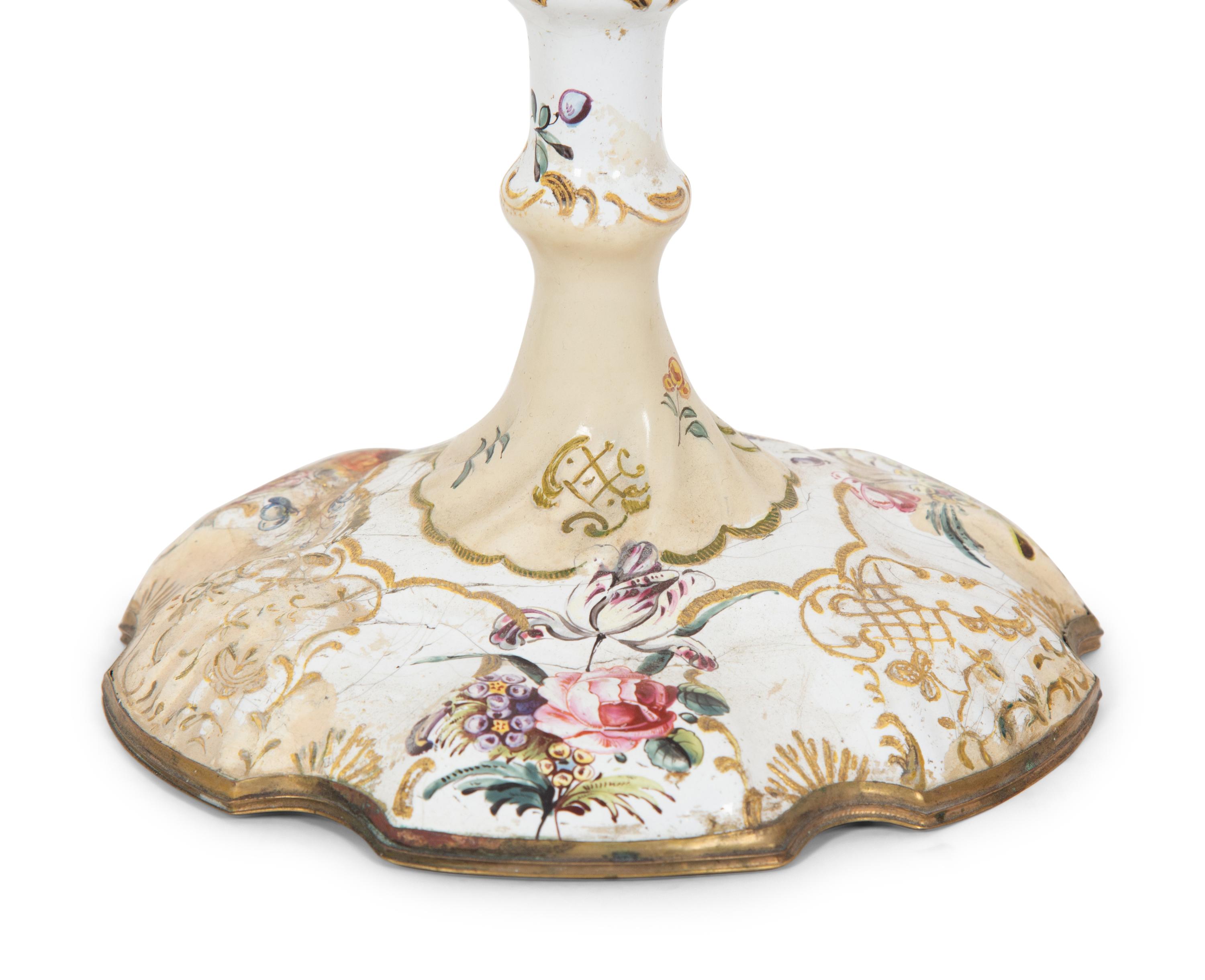 A Pair of Battersea Enameled Candlesticks