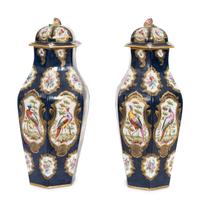A Pair of Worcester Cobalt Ground Parcel Gilt Porcelain Urns