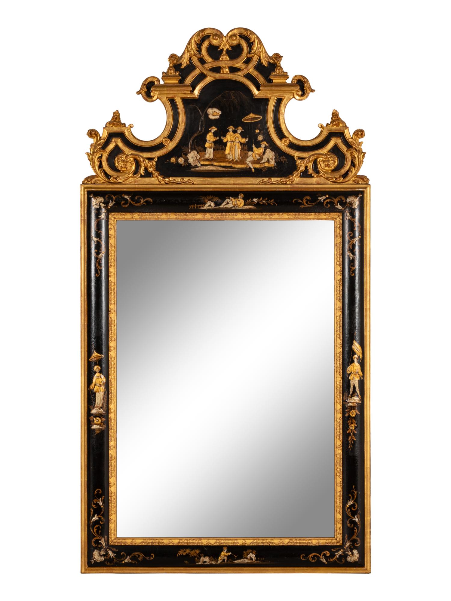 A Régence Style Chinoiserie Ebonized and Giltwood Mirror